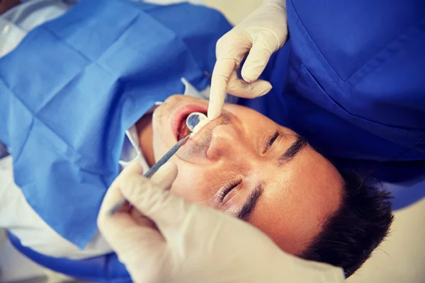 depositphotos 109146670 stock photo close up of dentist checking